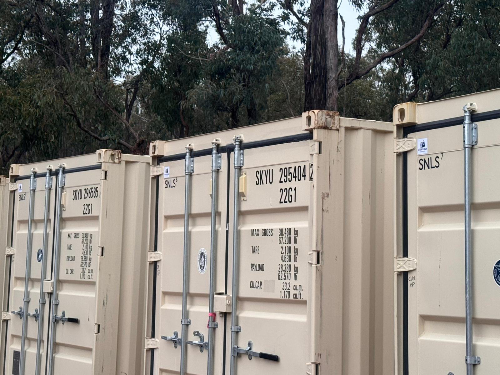 Stock'n Lock 20ft shipping containers in the Perth yard, showing the SKYU numbers and 22G1 type code on the doors